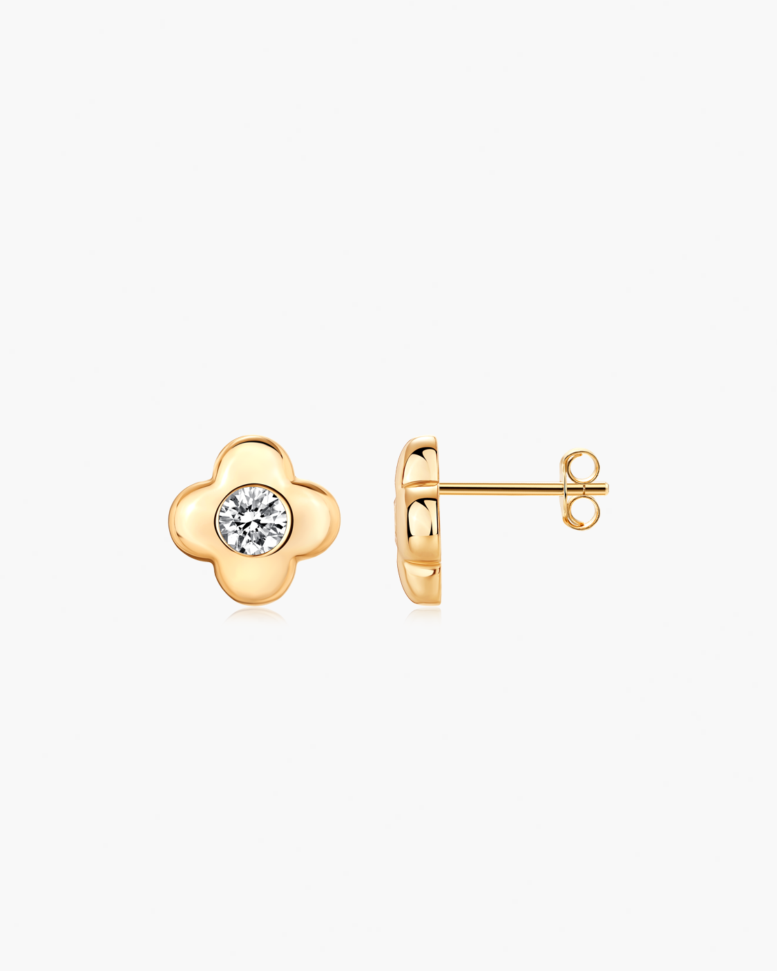 Gold earrings with a central gemstone on a white background
