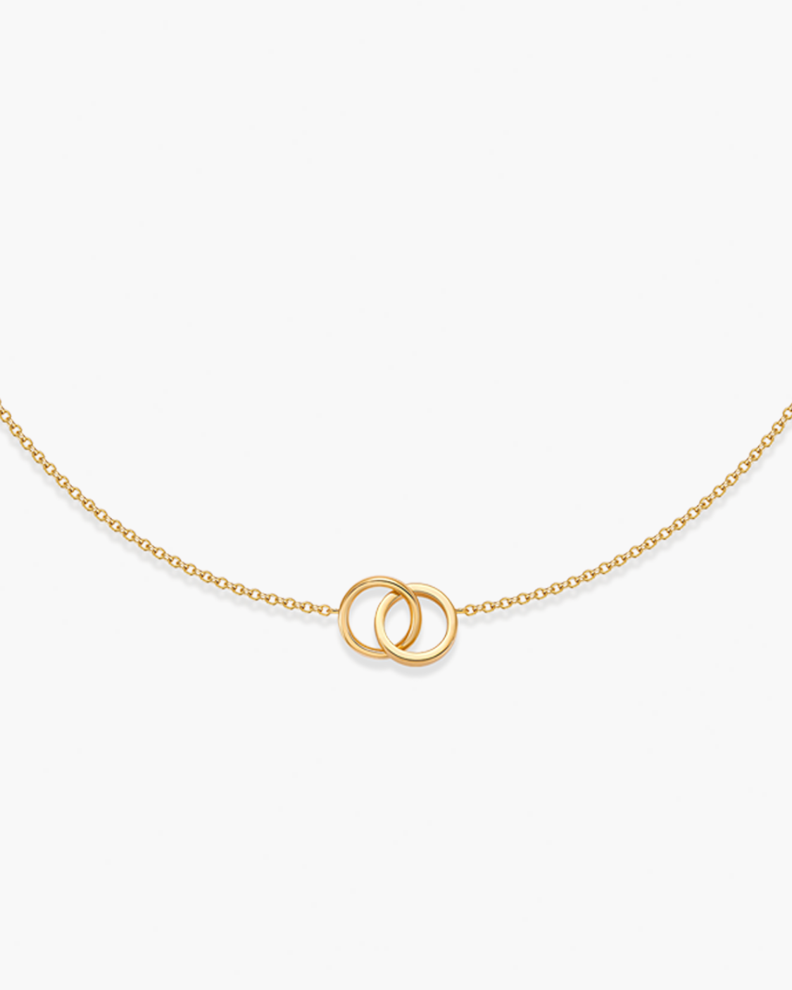 Gold necklace with interlocking rings on a white background