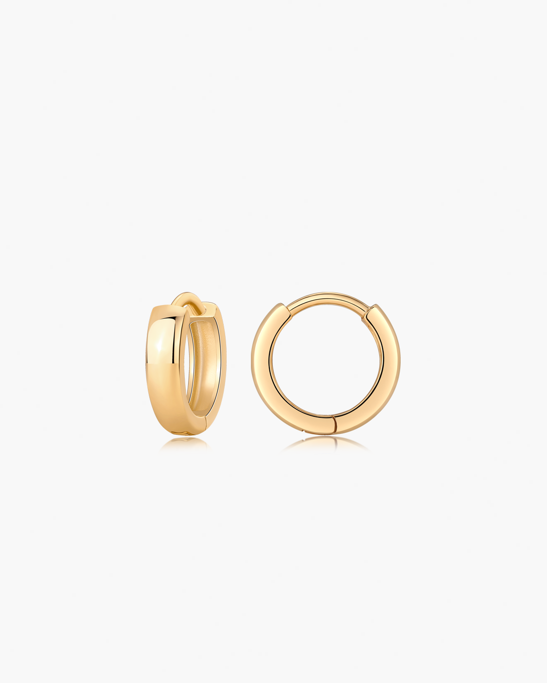 Gold hoop earrings on a white background