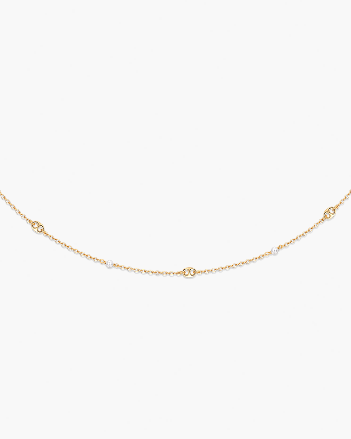 Gold chain necklace on a white background