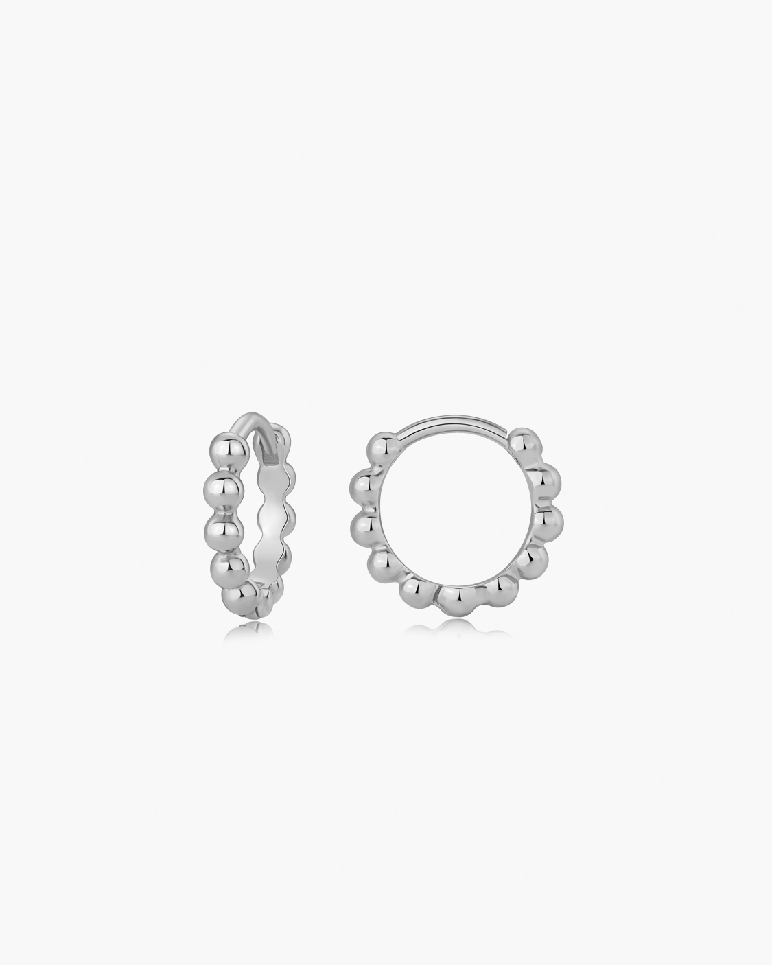Silver hoop earrings on a white background