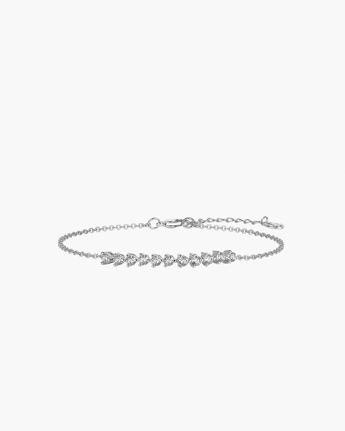 Silver bracelet with floral design on a white background