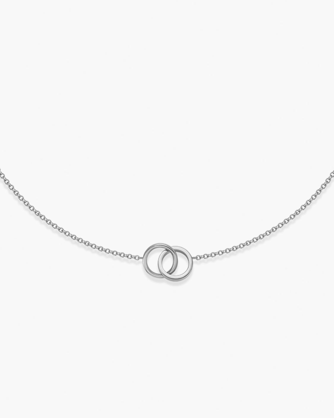 Silver necklace with interlocking rings on a white background
