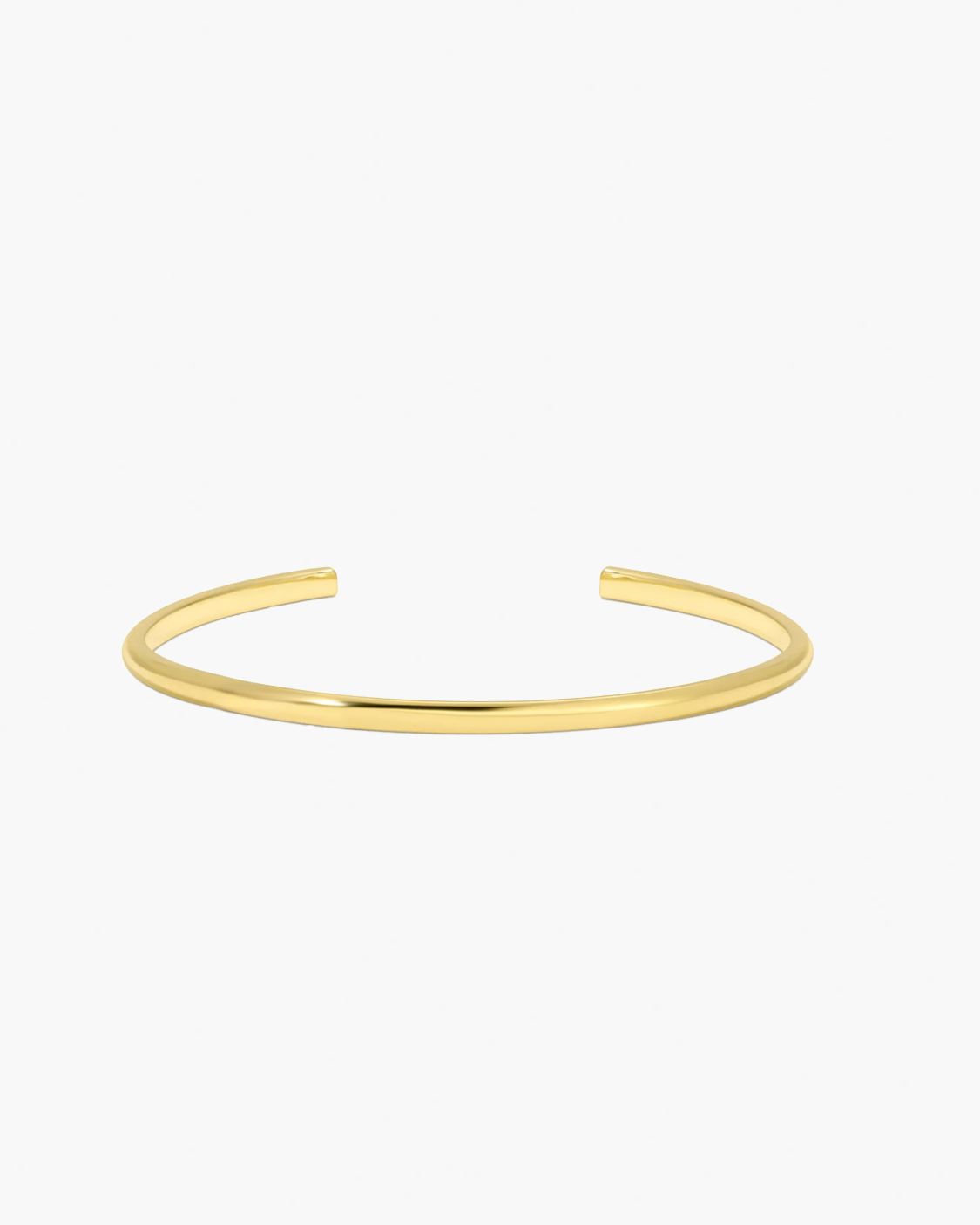 Gold arm cuff on a white background