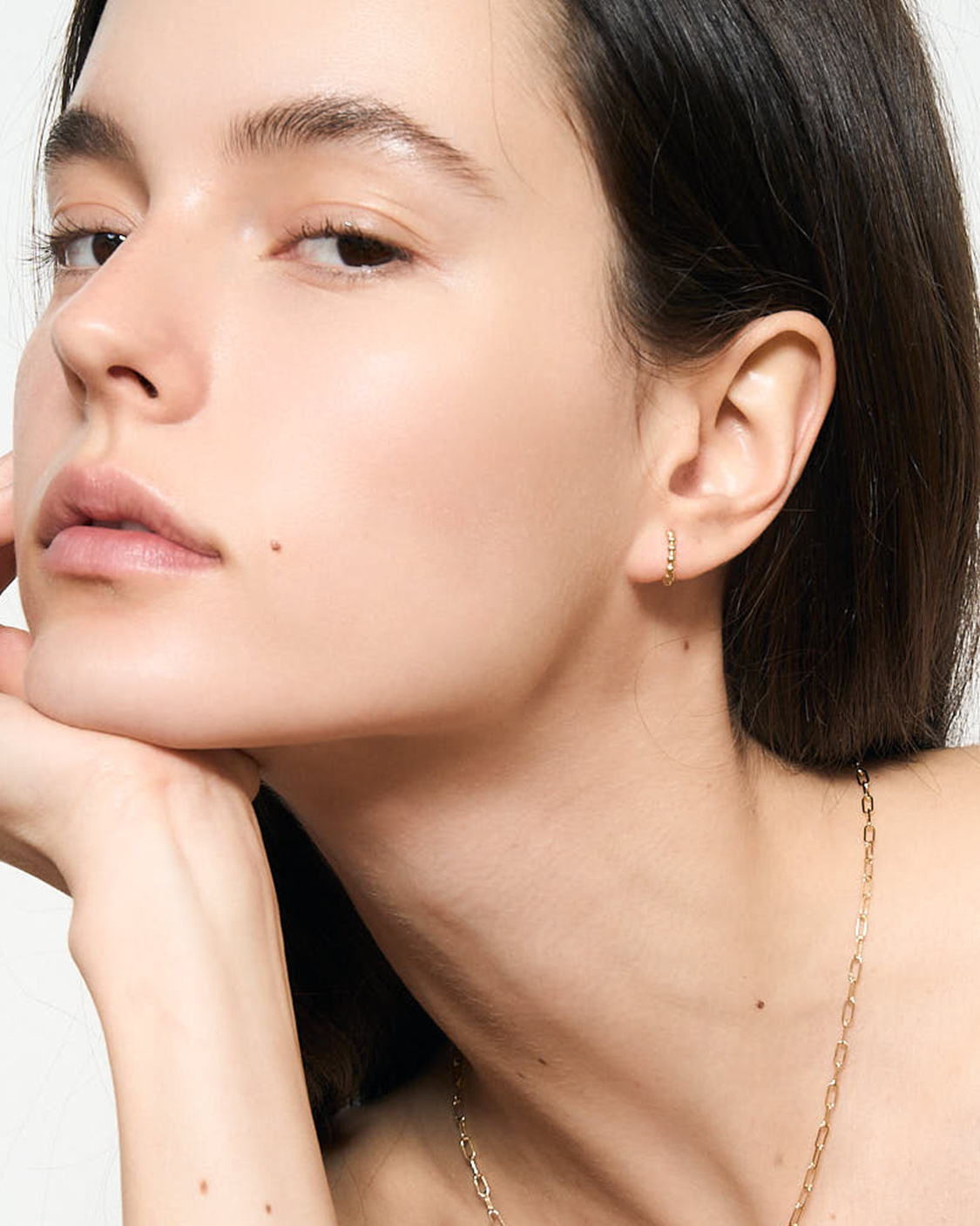 Model wearing Gold hoop earring