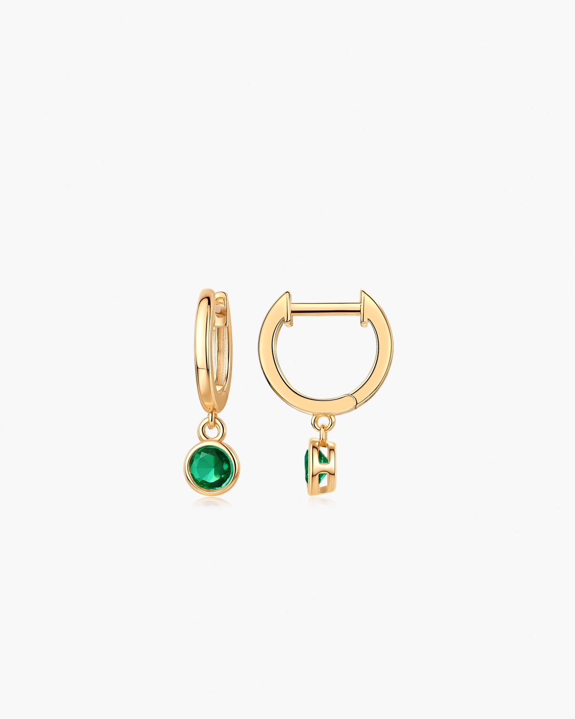 Gold hoop earrings with green gemstones 