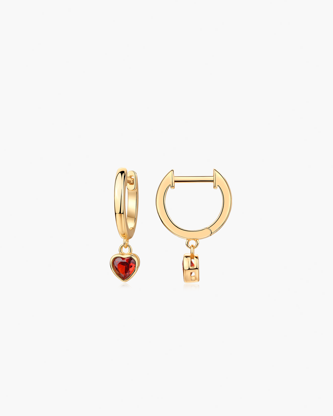 Gold hoop earrings with heart and lock charms on a white background