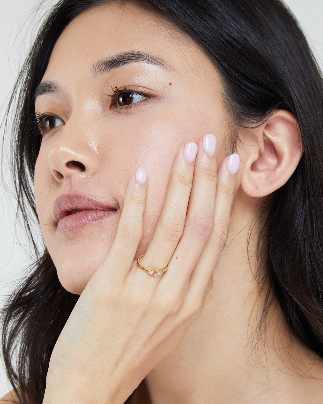 woman wearing pink reve ring.