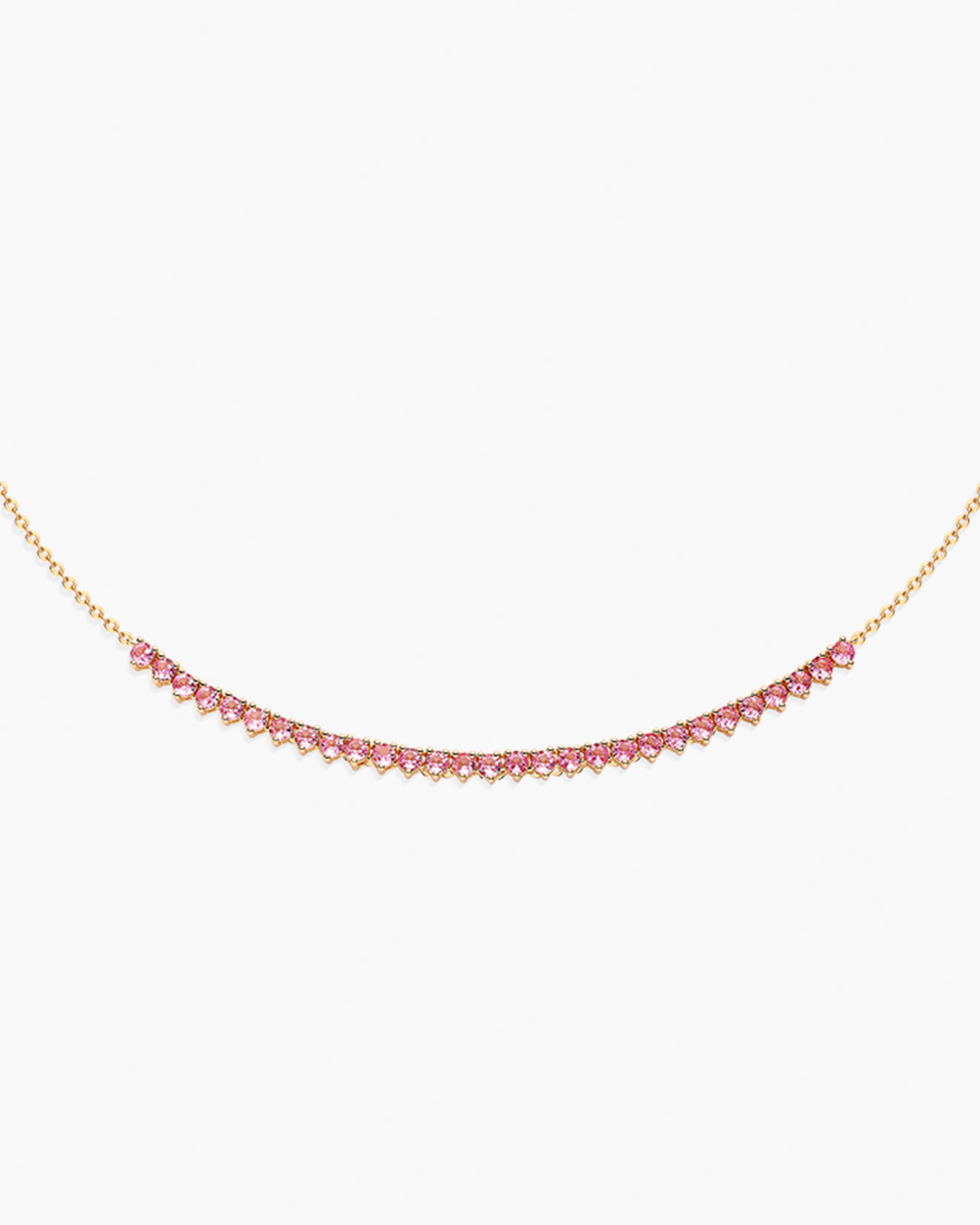 Necklace with pink gemstones on a gold chain against a white background