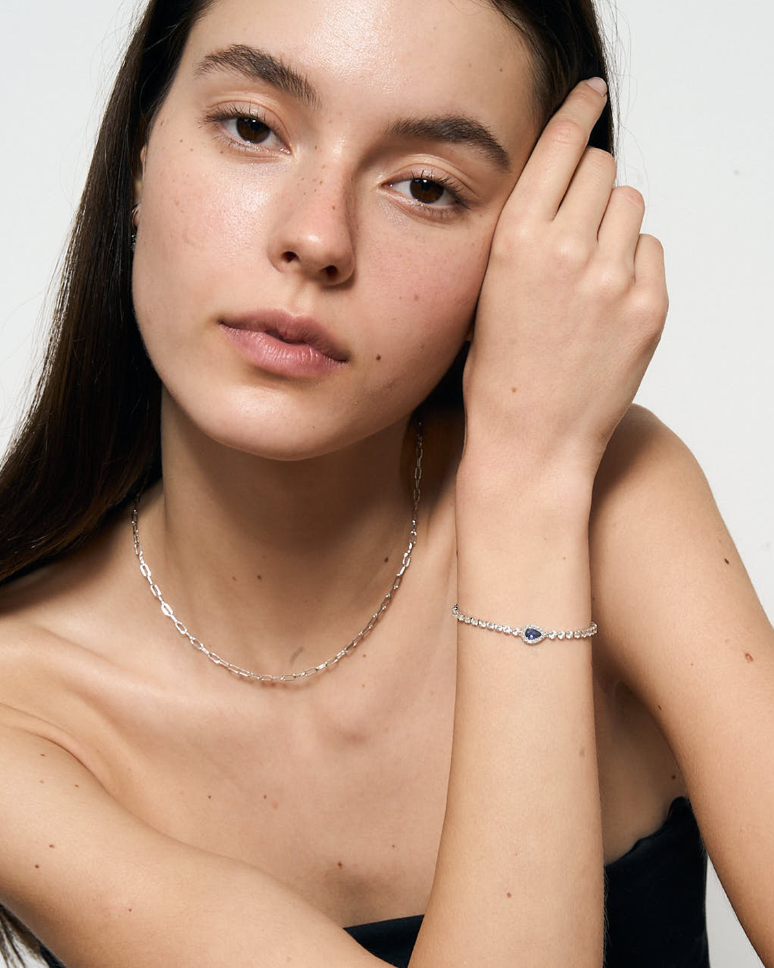 woman with blue bracelet