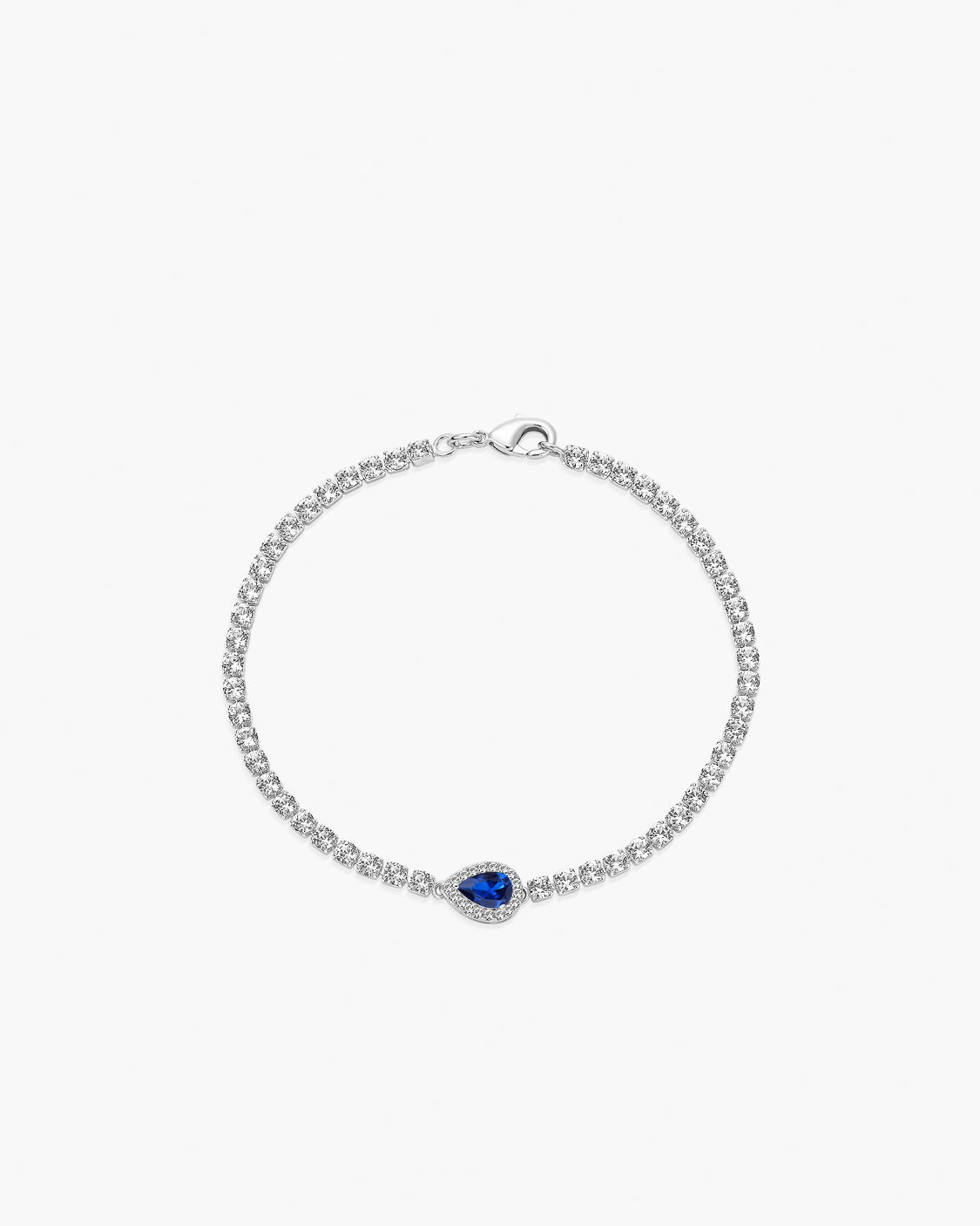 Silver bracelet with a blue gemstone on a white background