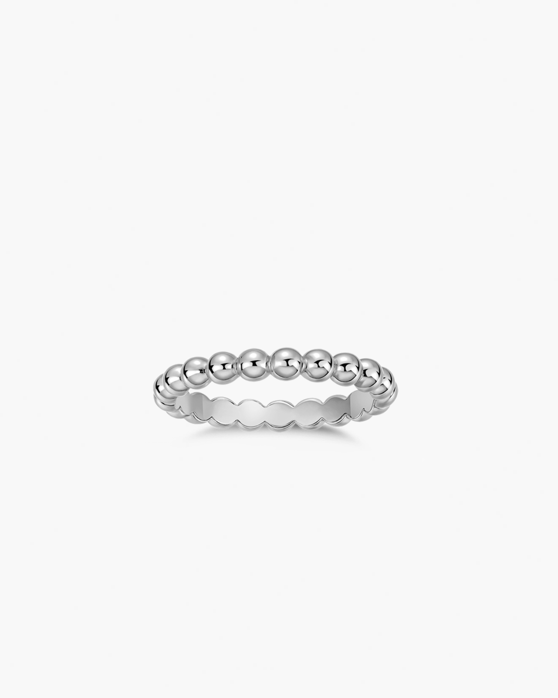 Silver ring with beaded design on a white background