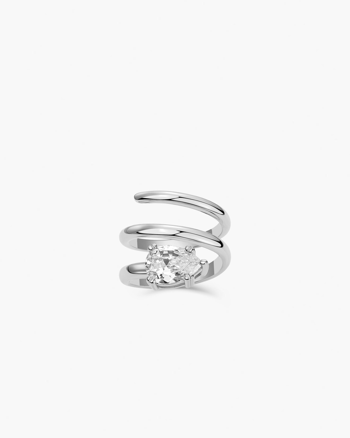 Silver spiral ring with a clear tear drop gemstone on a white background