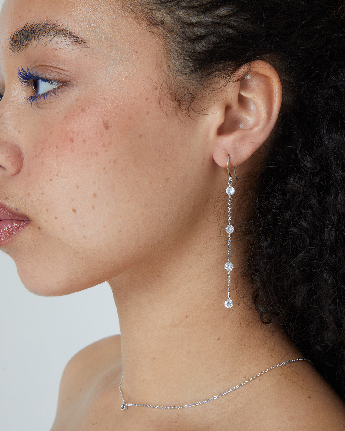 Woman wearing a silver drop earrings