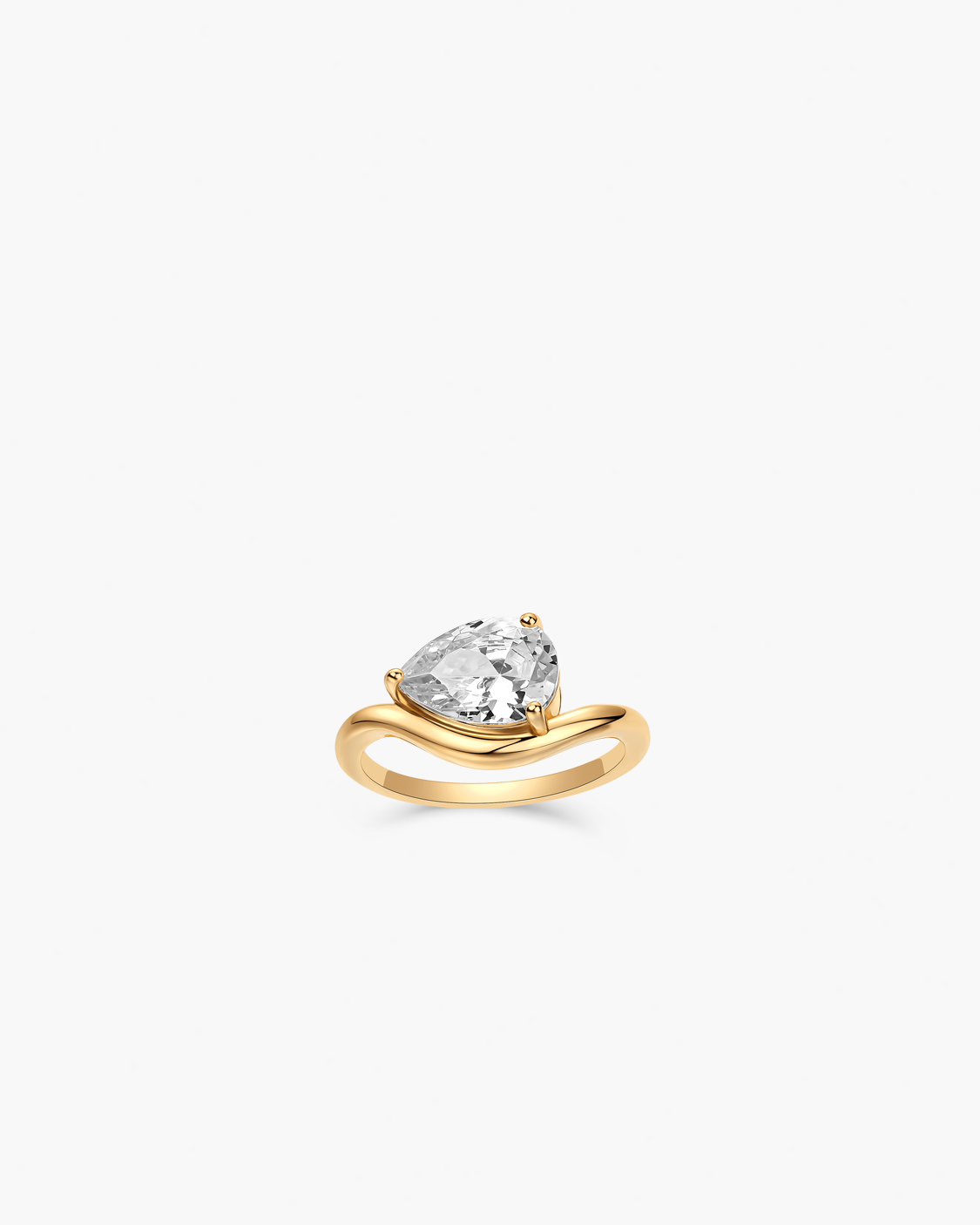Gold ring with a clear gemstone on a white background