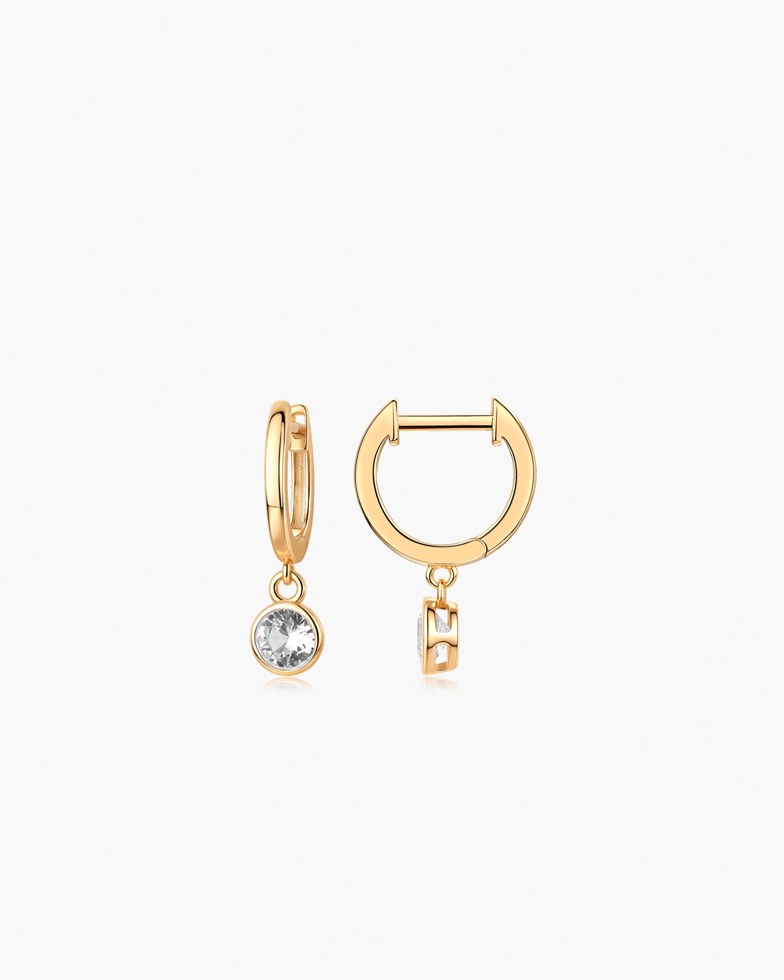 Gold hoop earrings with white gemstones